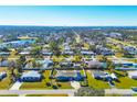 Aerial view showcasing a home's neighborhood and surrounding area at 221 E Wentworth St, Englewood, FL 34223