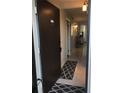 Interior view of condo entryway, tiled floors and open door at 244 Saint Augustine Ave # 102, Venice, FL 34285