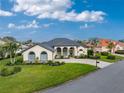 Single-story home with tile roof, landscaped yard, and driveway at 3310 Bay Ridge Way, Port Charlotte, FL 33953