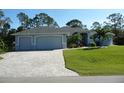 Beautiful home with three-car garage and paver driveway at 380 Hoffer St, Port Charlotte, FL 33953