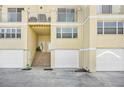 Ground level view of townhouses with private entrances and garages at 4410 Warren Ave # 503, Port Charlotte, FL 33953