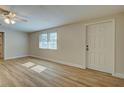 Spacious living room featuring hardwood floors and ceiling fan at 450 Blackburn St, Englewood, FL 34223