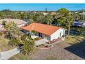 Aerial view of single Gathering home with canal access at 4696 Pompano St, Placida, FL 33946