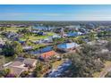 Aerial view of canal front home in a peaceful neighborhood at 4696 Pompano St, Placida, FL 33946