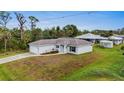 One-story house with a driveway and spacious backyard at 5400 Jennings Blvd, Port Charlotte, FL 33981