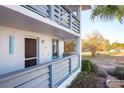 Exterior view of condo building showcasing a welcoming entrance and waterfront views at 6800 Placida Rd # 165, Englewood, FL 34224