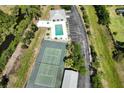 Community features pool, tennis court, and parking at 8050 Memory Ln # 104, Rotonda West, FL 33947