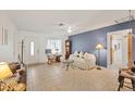 Bright living room with tiled floors and access to other rooms at 9261 Saint Catherine Ave, Englewood, FL 34224