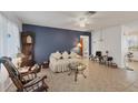 Cozy living room featuring a comfortable couch and a grandfather clock at 9261 Saint Catherine Ave, Englewood, FL 34224