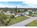 Aerial view of a single-Gathering home with a large backyard and a neighborhood setting at 1035 Oleander St, Englewood, FL 34223