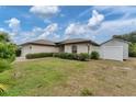 House exterior showcasing a shed and fenced backyard at 11091 Corrigan Ave, Englewood, FL 34224