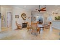 Spacious living room with tile floors, ceiling fan, and comfortable seating at 13048 Creekside Ln, Port Charlotte, FL 33953