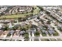 Aerial view of a residential neighborhood with houses, streets and trees at 1441 Strada D Oro, Venice, FL 34292