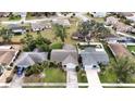 Aerial view of a single Gathering home with a large backyard and driveway at 1441 Strada D Oro, Venice, FL 34292