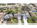 Aerial view of a single Gathering home with a large backyard and driveway at 1441 Strada D Oro, Venice, FL 34292