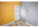 Inviting entryway with tiled floor and a white door at 15120 Payne St, Punta Gorda, FL 33955