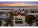 Luxury beachfront home showcasing beautiful sunset views at 16271 N Island Ct, Boca Grande, FL 33921