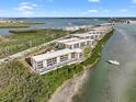 Aerial view of waterfront property, highlighting its prime location and expansive views at 1751 Beach Rd # 403, Englewood, FL 34223