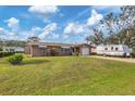 Ranch home with a spacious yard and RV parking at 1780 Morning Dove Ln, Englewood, FL 34224