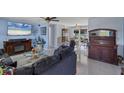 Bright living room with comfortable seating and a fireplace at 1780 Morning Dove Ln, Englewood, FL 34224