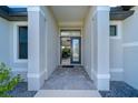 Front entry with tile flooring and glass door at 226 Rotonda N Blvd, Rotonda West, FL 33947
