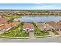 Stunning property with a lake view, surrounded by other upscale homes at 26837 Weiskopf Dr, Englewood, FL 34223