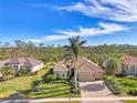 One-story house with tile roof, palm trees, and a large yard at 2744 Mill Creek Rd, Port Charlotte, FL 33953