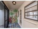 Bright and inviting entryway with a tropical mural and tiled floors at 365 Englewood Isles Pkwy # 3, Englewood, FL 34223