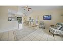 Spacious living area with tile floors and comfy seating at 4490 Gillot Blvd, Port Charlotte, FL 33981