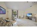 Comfortable living room with tiled floor and two armchairs at 4490 Gillot Blvd, Port Charlotte, FL 33981