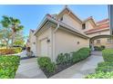 Townhome with two-car garage and lush landscaping at 4628 Club Dr # H201, Port Charlotte, FL 33953