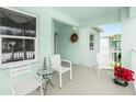 Small balcony with patio furniture, offering a peaceful view at 5725 Greenwood Ave # 6204, North Port, FL 34287
