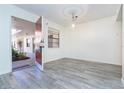 Bright dining area with gray wood-look floors at 66 Boundary Blvd # 280, Rotonda West, FL 33947