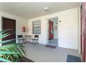 Inviting condo entry with small table and chairs at 66 Boundary Blvd # 280, Rotonda West, FL 33947