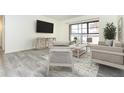 Living room with comfy seating and sliding glass doors at 66 Boundary Blvd # 280, Rotonda West, FL 33947
