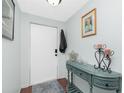 Entryway with console table and decorative accents at 672 Circlewood Dr # V9, Venice, FL 34293
