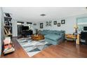 Spacious living room with sectional sofa and wood floors at 672 Circlewood Dr # V9, Venice, FL 34293