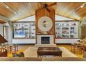 Spacious living area with built-in shelving and fireplace at 7475 Manasota Key Rd, Englewood, FL 34223