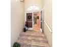 Inviting entryway with double doors and decorative wreaths at 10479 Coquina Ct, Placida, FL 33946
