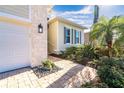 Stone walkway leading to the entrance of the home at 10479 Coquina Ct, Placida, FL 33946