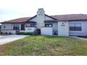 Two-unit building, featuring a well-maintained exterior and landscaping at 13100 S Mccall Rd # 110, Port Charlotte, FL 33981