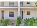 Inviting condo exterior featuring a well-maintained facade, manicured landscaping, and a private entrance at 1730 Manasota Beach Rd # 110, Englewood, FL 34223