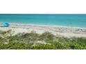 Scenic beachfront view with tranquil ocean and sandy shore at 1760 Gulf Blvd # 511, Englewood, FL 34223