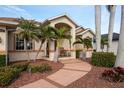 Relaxing front porch with rocking chairs and palm trees at 185 Rotonda E Blvd, Rotonda West, FL 33947