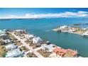 Wide aerial view showcasing waterfront homes and the surrounding waterways at 1924 Mississippi Ave, Englewood, FL 34224