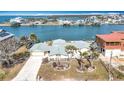 Aerial view of waterfront home with landscaped yard and canal access at 1924 Mississippi Ave, Englewood, FL 34224