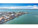 Aerial perspective of waterfront community, featuring various houses and boat docks at 1924 Mississippi Ave, Englewood, FL 34224