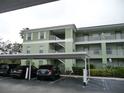 Condo building with covered parking and landscaping at 2121 Heron Lake Dr # 301, Punta Gorda, FL 33983