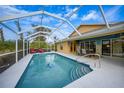Screened pool area with patio furniture and a spacious deck at 215 Australian Dr, Rotonda West, FL 33947