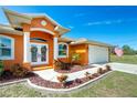 Welcoming front entrance with double doors and neatly landscaped walkway at 2194 Wenona Dr, North Port, FL 34288